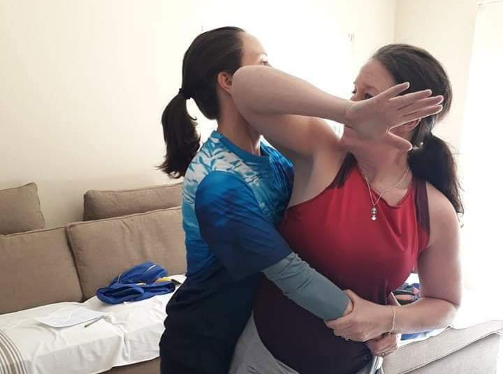 Image of two women practising self defence